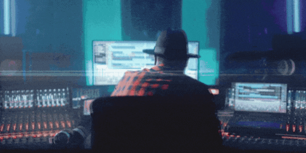 A compilation of alternating shots. One featuring an individual wearing headphones in a recording studio with a purple hue; one with an individual in front of a monitor in the midst of production, nodding their head along; one with an individual wearing headphones in front of a microphone, and making gestures with their hands.